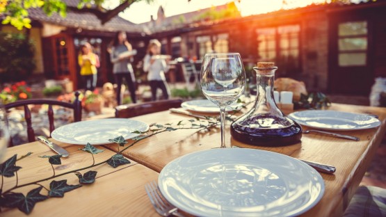 Family preparing dining table for lunch